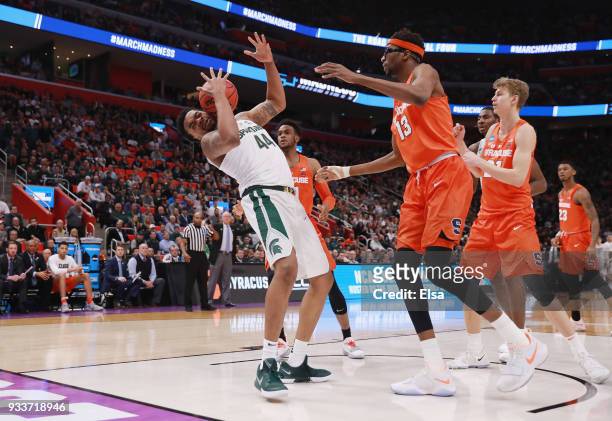 Nick Ward of the Michigan State Spartans battles for a rebound with Paschal Chukwu of the Syracuse Orange during the first half in the second round...
