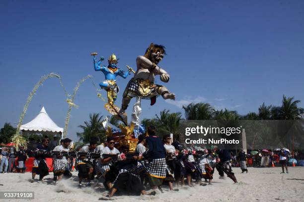 Participant carrying a giant Effigy, known as Ogoh-ogoh, during an Effigy festival at Ancol beach, North Jakarta, on Sunday, March 18, 2018. The...