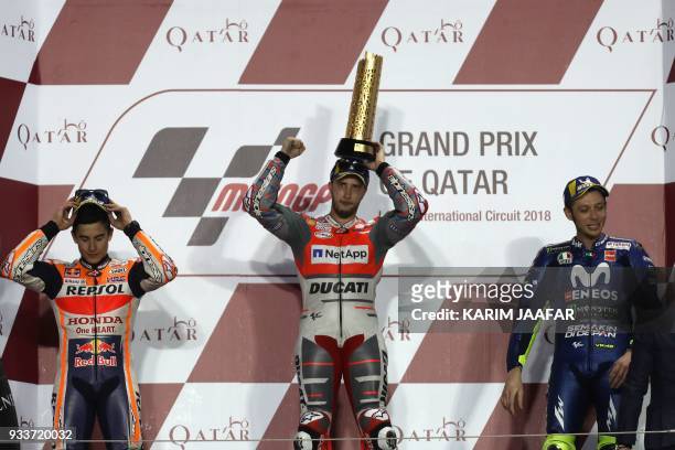 Repsol Honda Team's Spanish rider Marc Marquez , Ducati Team's Italian rider Andrea Dovizioso and Movistar Yamaha MotoGP's Italian rider Valentino...
