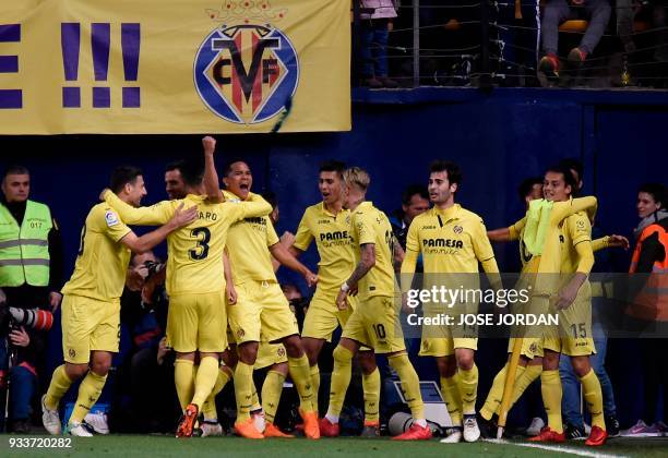 Villarreal players celebrate their second goal during the Spanish League football match between Villarreal CF and Club Atletico de Madrid at La...