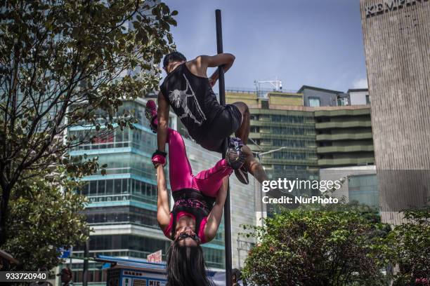 An Indonesian dancer practices pole dance at Hotel Indonesia Roundabout in Jakarta, Indonesia on March 18, 2018. In recent years many people started...