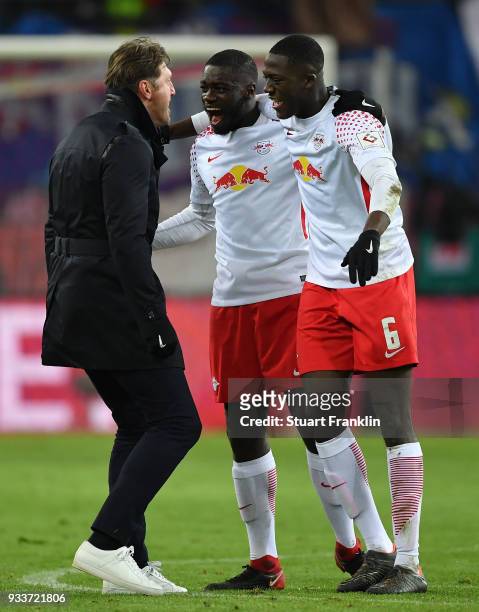 Ralph Hasenhttl, head coach of Leipzig celebrates with Ibrahima Konat and Dayot Upamecano after the Bundesliga match between RB Leipzig and FC...