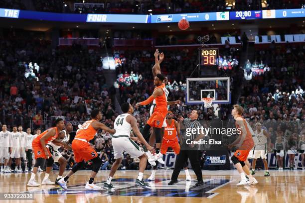 Oshae Brissett of the Syracuse Orange and Jaren Jackson Jr. #2 of the Michigan State Spartans battle for the opening tipoff during the first half in...