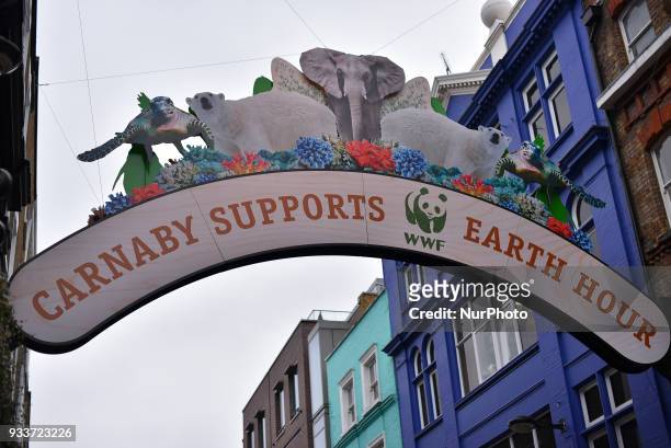 Giant banner of WWF is pictured in Carnaby Street, London on March 18, 2018. The WWF Earth Hour will take place on Saturday 24 March at 8:30pm, when...