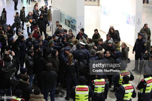 Police circled the group of activists. About 30-40 people protested spontaneously at the Munich Central Station against turkish war against Afrin in...