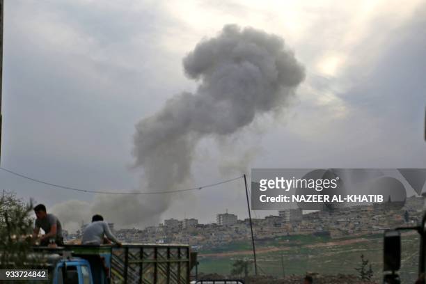 Smoke billows following the explosion in the northwestern Syrian city of Afrin after Syrian-Arab Turkish backed fighters took control of the city...