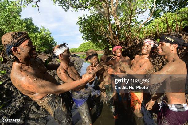 The first day of New Year of Caka 1940, people in Kedonganan Village, Bali held a 'Mabuug-buugan' ritual by smearing their bodies with mud, on March...