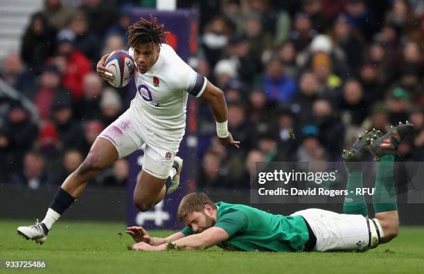 Anthony Watson of England moves away from Iain Henderson during the NatWest Six Nations match between England and Ireland at Twickenham Stadium on...