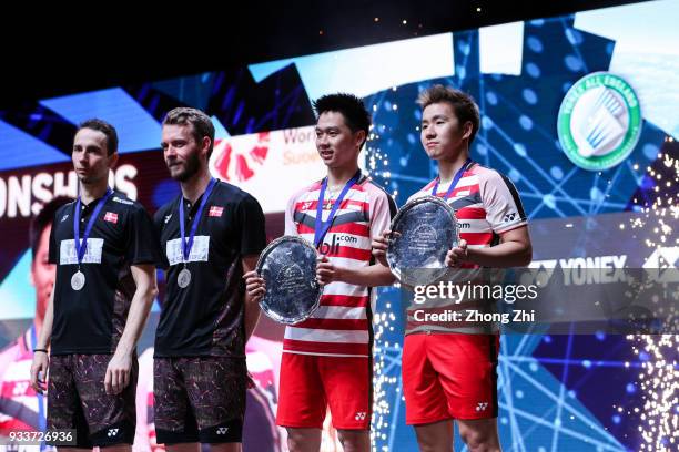 Mathias Boe of Denmark and Carsten Mogensen of Denmark, and Kevin Sanjaya Sukamuljo of Indonesia and Marcus Fernaldi Gideon of Indonesia pose for...