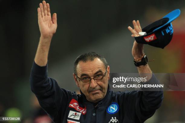 Napoli's coach Maurizio Sarri greets fans before the Italian Serie A football match SSC Napoli vs Genoa CFC on March 18, 2018 at the San Paolo...