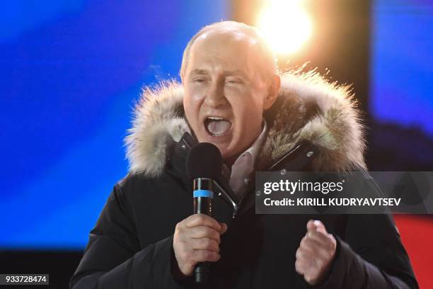 Presidential candidate, President Vladimir Putin addresses the crowd during a rally and a concert celebrating the fourth anniversary of Russia's...