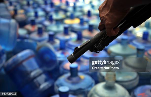 Sub-standard water jars are being destroyed at Matsya Bhaban road in Dhaka, Bangladesh, on 18 March 2018 during a raid conducted by district...