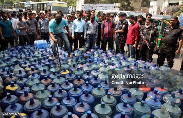 Sub-standard water jars are being destroyed at Matsya Bhaban road in Dhaka, Bangladesh, on 18 March 2018 during a raid conducted by district...