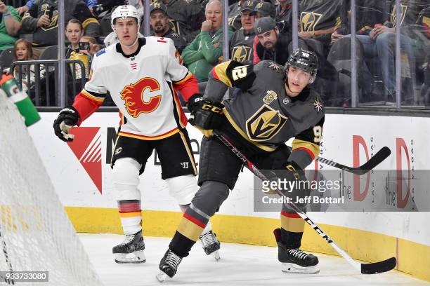 Michael Stone of the Calgary Flames defends Tomas Nosek of the Vegas Golden Knights during the game at T-Mobile Arena on March 18, 2018 in Las Vegas,...