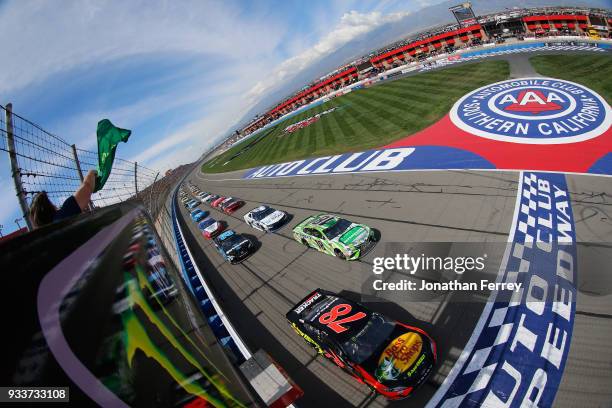 Martin Truex Jr., driver of the Bass Pro Shops/5-hour ENERGY Toyota, leads the field to green to start the Monster Energy NASCAR Cup Series Auto Club...