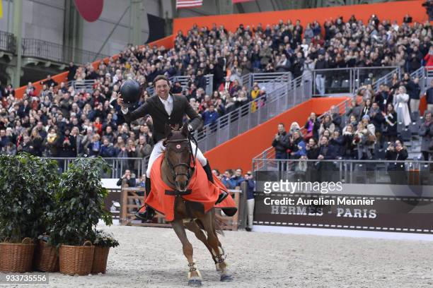 Simon Delestre of France on Hermes Ryan cheers with the crowd after winning the Saut Hermes at Le Grand Palais on March 18, 2018 in Paris, France.