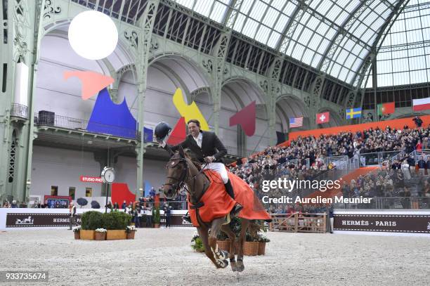 Simon Delestre of France on Hermes Ryan cheers with the crowd after winning the Saut Hermes at Le Grand Palais on March 18, 2018 in Paris, France.