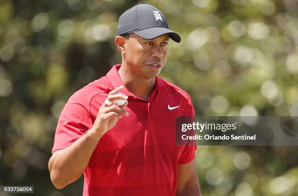 Tiger Woods acknowledges the cheering crowd after a putt during the Arnold Palmer Invitational on Sunday, March 18, 2018 at Bay Hill Club & Lodge in...