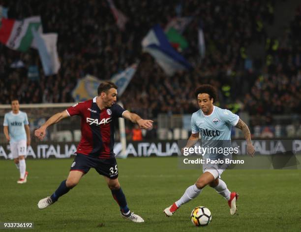 Vasilis Torosidis of Bologna FC competes for the ball with Felipe Anderson of SS Lazio during the serie A match between SS Lazio and Bologna FC at...