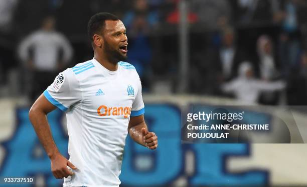 Olympique de Marseille's Portuguese defender Rolando celebrates after scoring a goal during the French L1 football match Marseille vs Lyon on March...