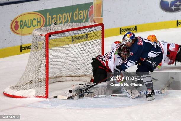 Jon Matsumoto of Red Bull Munich scores the 5:2 during the DEL Playoff Quarterfinal match 3 between the EHC Red Bull Munich and Pinguins Bremerhaven...