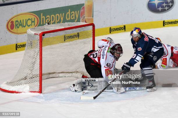 Jon Matsumoto of Red Bull Munich scores the 5:2 during the DEL Playoff Quarterfinal match 3 between the EHC Red Bull Munich and Pinguins Bremerhaven...