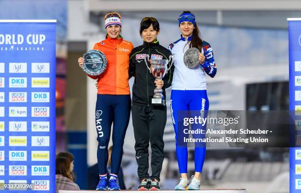 Marrit Leenstra of the Netherlands, Miho Takagi of Japan and Yekaterina Shikhova of Russia stand on the podium after the Overall Classification of...