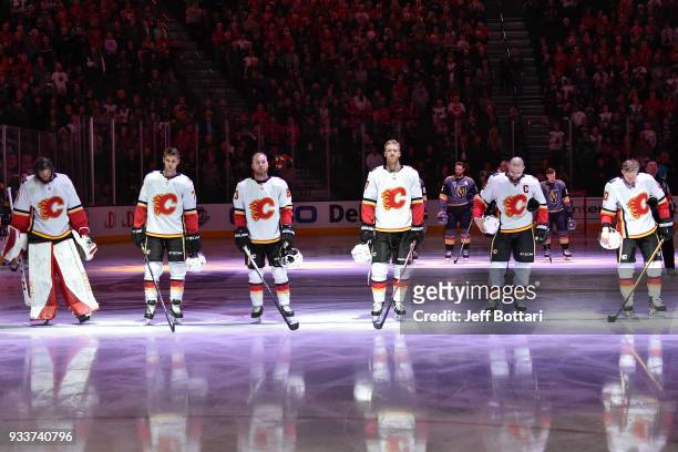 Mike Smith, Mark Jankowski, Sam Bennett, Dougie Hamilton, Mark Giordano and Kris Versteeg of the Calgary Flames stand during the national anthem...