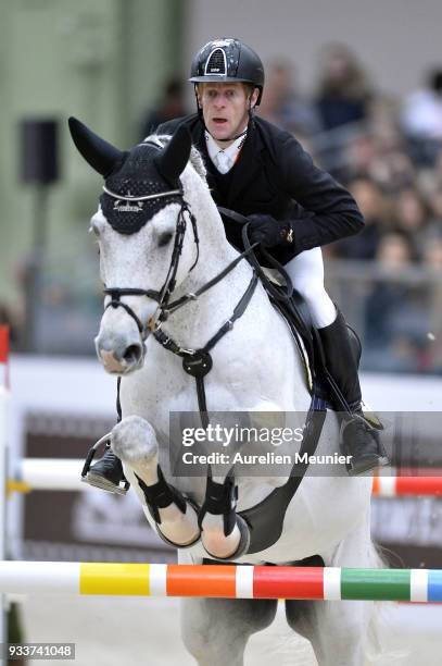 Marcus Ehning of Germany on Cornado NRW competes during the Saut Hermes at Le Grand Palais on March 18, 2018 in Paris, France.