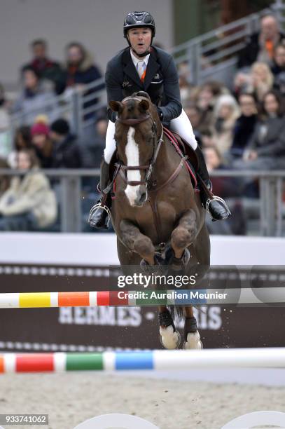 Patrice Delaveau of France on Aquila HDC competes during the Saut Hermes at Le Grand Palais on March 18, 2018 in Paris, France.