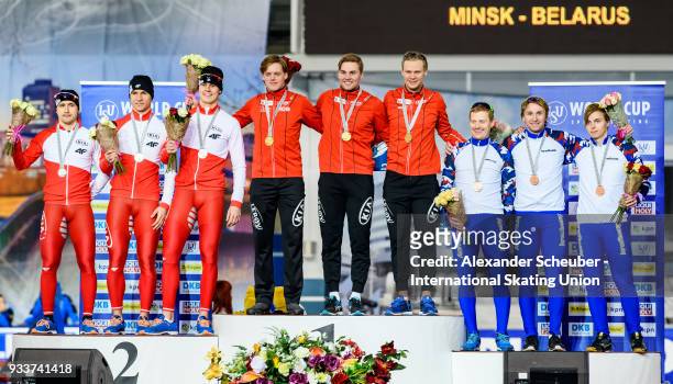 Athletes of the Poland, Norway and Russia stand on the podium after the Men's Team Sprint Final during the ISU World Cup Speed Skating Final Day 2 at...