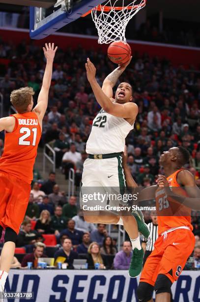 Miles Bridges of the Michigan State Spartans dunks the ball during the second half against the Syracuse Orange in the second round of the 2018 NCAA...