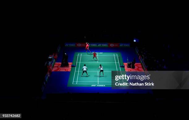 Zheng Siwei and Hunag Yaqiong of China of compete against Yuta Watanabe and Arisa Higashino of Japan on day five of the Yonex All England Open...