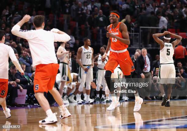 Paschal Chukwu of the Syracuse Orange celebrates defeating the Michigan State Spartans 55-53 in the second round of the 2018 NCAA Men's Basketball...
