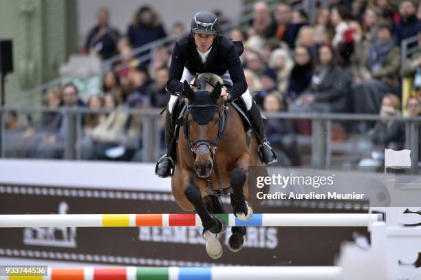Steve Guerdat of Switzerland on Corbinian competes during the Saut Hermes at Le Grand Palais on March 18, 2018 in Paris, France.
