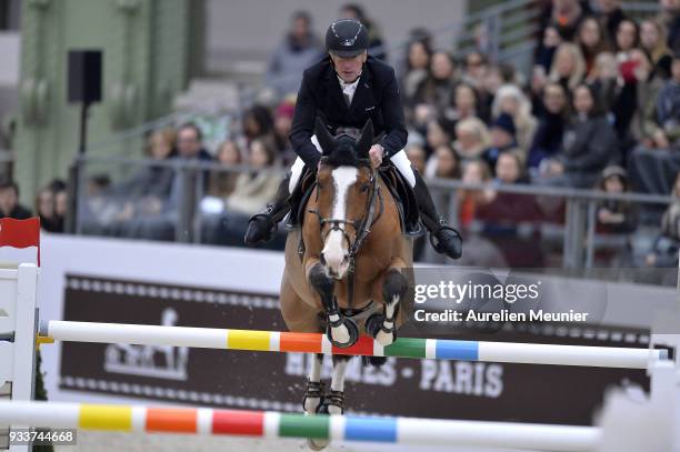 Roger Yves Bost of France on Sangria du Coty competes during the Saut Hermes at Le Grand Palais on March 18, 2018 in Paris, France.