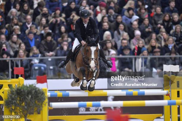 Roger Yves Bost of France on Sangria du Coty competes during the Saut Hermes at Le Grand Palais on March 18, 2018 in Paris, France.