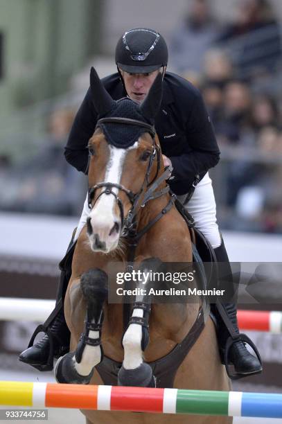 Roger Yves Bost of France on Sangria du Coty competes during the Saut Hermes at Le Grand Palais on March 18, 2018 in Paris, France.