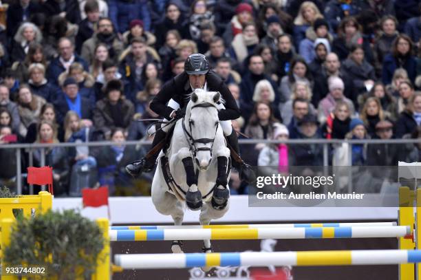 Andy Kocher of the United States Of America on Navalo de Poheton competes during the Saut Hermes at Le Grand Palais on March 18, 2018 in Paris,...