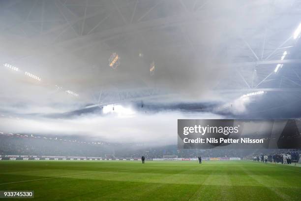 Smoke from flares fills the arena ahead of the Swedish Cup Semifinal between AIK and Djurgardens IF at Friends arena on March 18, 2018 in Solna,...