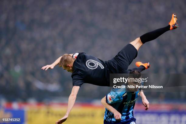 Rasmus Lindkvist of AIK is tackled by Haris Radetinac of Djurgardens IF during the Swedish Cup Semifinal between AIK and Djurgardens IF at Friends...