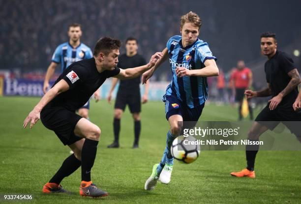 Jonathan Augustinsson of Djurgardens IF and Haukur Hauksson of AIK competes for the ballduring the Swedish Cup Semifinal between AIK and Djurgardens...