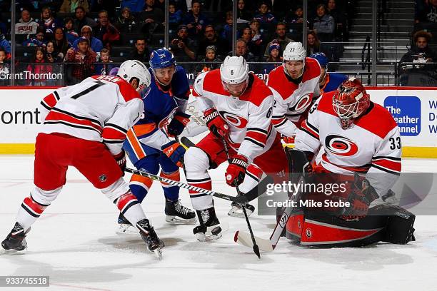 Derek Ryan, Klas Dahlbeck, Brett Pesce and Scott Darling of the Carolina Hurricanes defend the net amid pressure from Tanner Fritz of the New York...