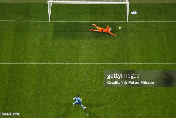 Oscar Linner of AIK makes a save on a penalty shot by Kerim Mrbati of Djurgardens IF during the Swedish Cup Semifinal between AIK and Djurgardens IF...