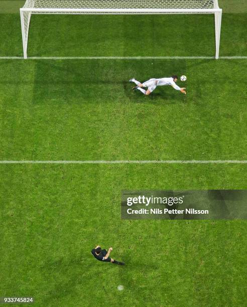 Andreas Isaksson of Djurgardens IF makes a save on a penalty shot by Tarik Elyounoussi of AIK during the Swedish Cup Semifinal between AIK and...