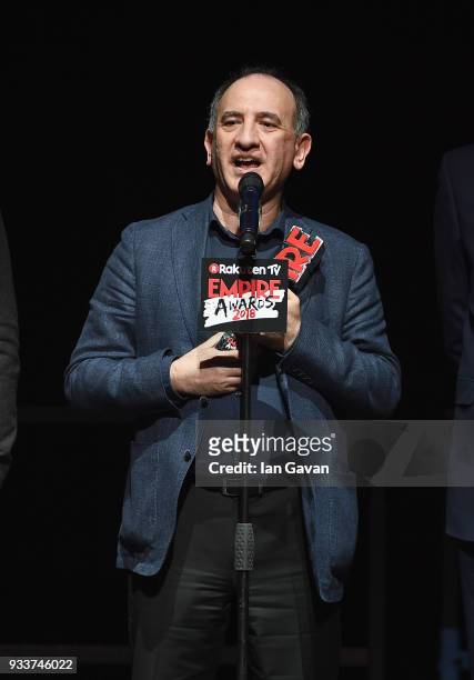 Actor Armando Iannucci, receives the award for Best Comedy for 'Death of Stalin', on stage during the Rakuten TV EMPIRE Awards 2018 at The Roundhouse...