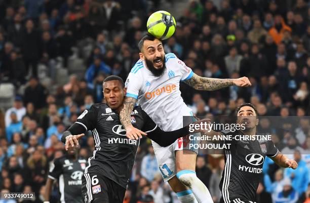 Olympique de Marseille's Greek forward Konstantinos Mitroglou vies with Lyon's Brazilian defender Marcelo during the French L1 football match...