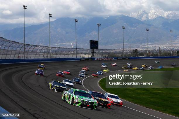 Kyle Busch, driver of the Interstate Batteries Toyota, Martin Truex Jr., driver of the Bass Pro Shops/5-hour ENERGY Toyota, and Brad Keselowski,...