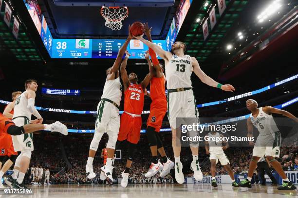 Ben Carter of the Michigan State Spartans battles for the ball against the Syracuse Orange in the second round of the 2018 NCAA Men's Basketball...