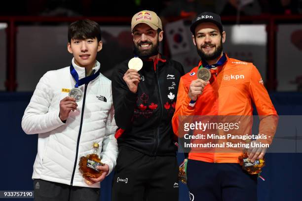 Hyo Jun Lim of Korea , Charles Hamelin of Canada and Sjinkie Knegt of the Netherlands hold up their medals after competing in the men's 1000 meter...
